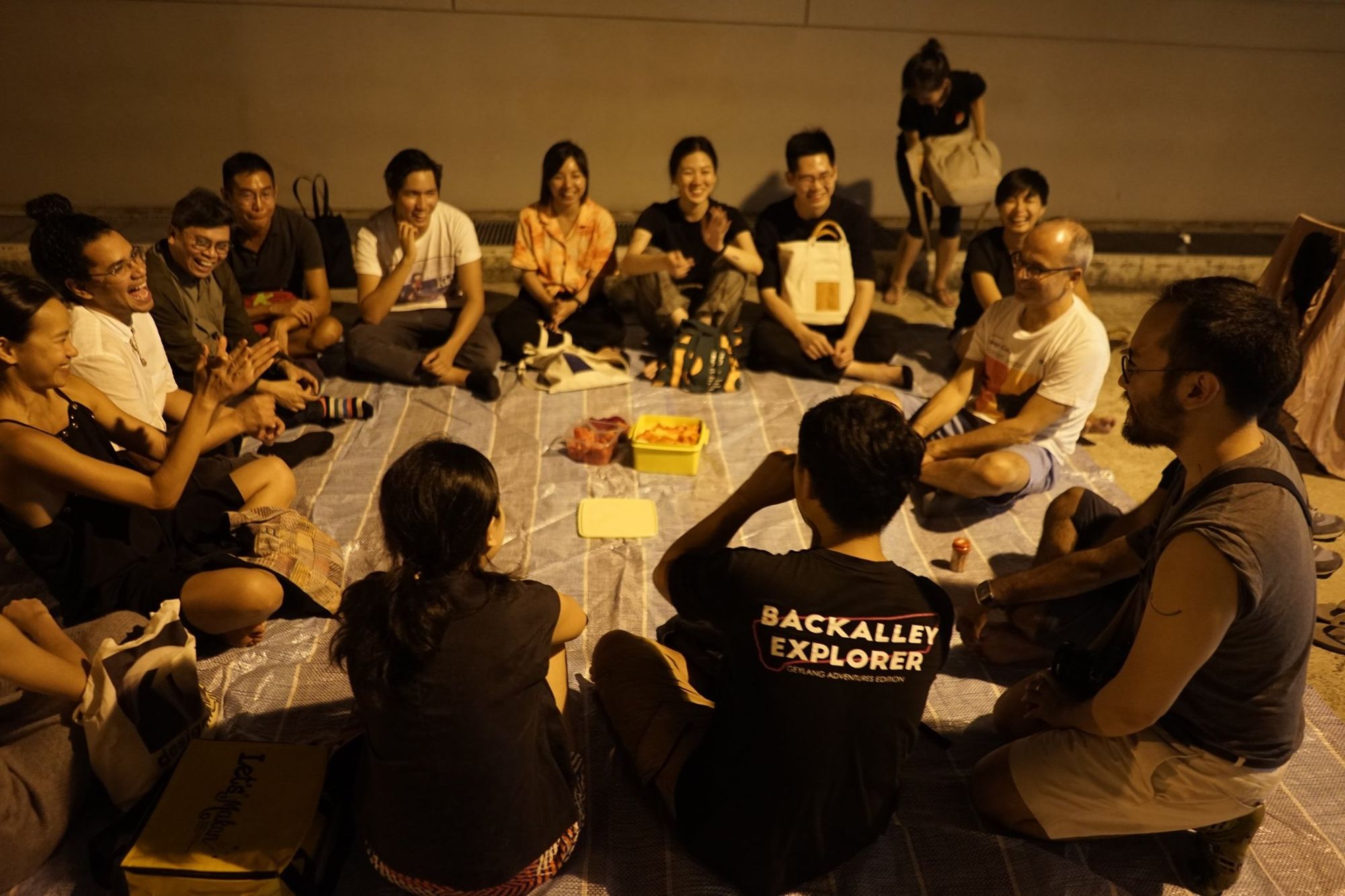Participants sitting in a circle on Geylang adventure tour