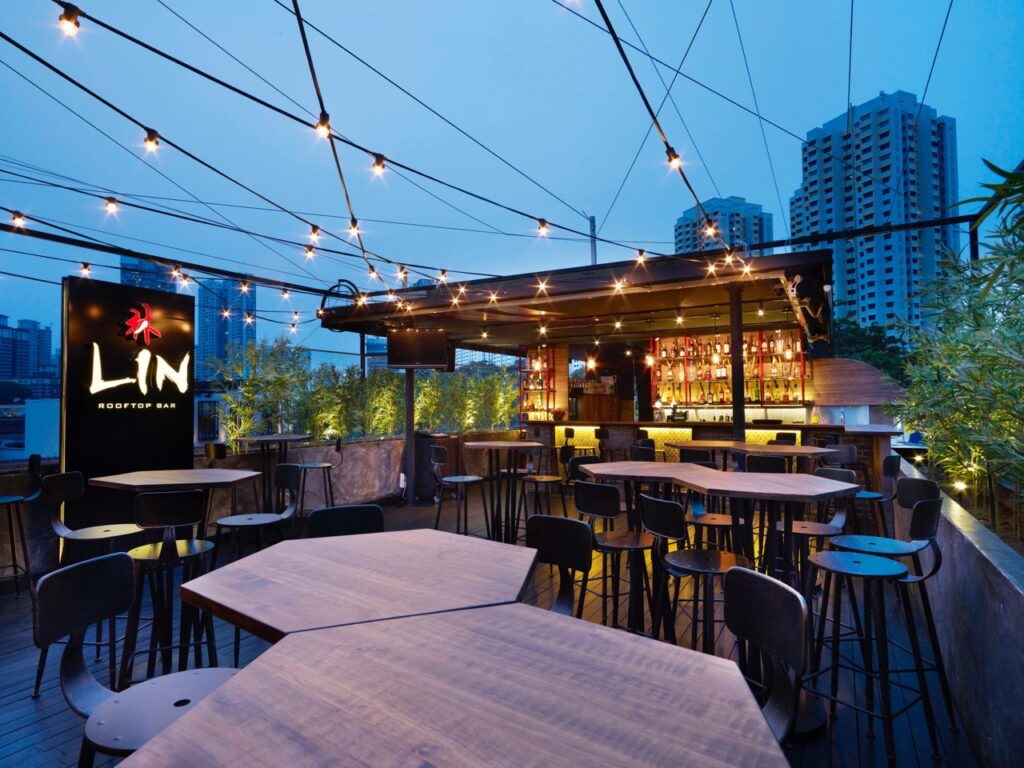 best affordable rooftop bar - lin rooftop bar - outdoor rooftop patio seating with hanging lights