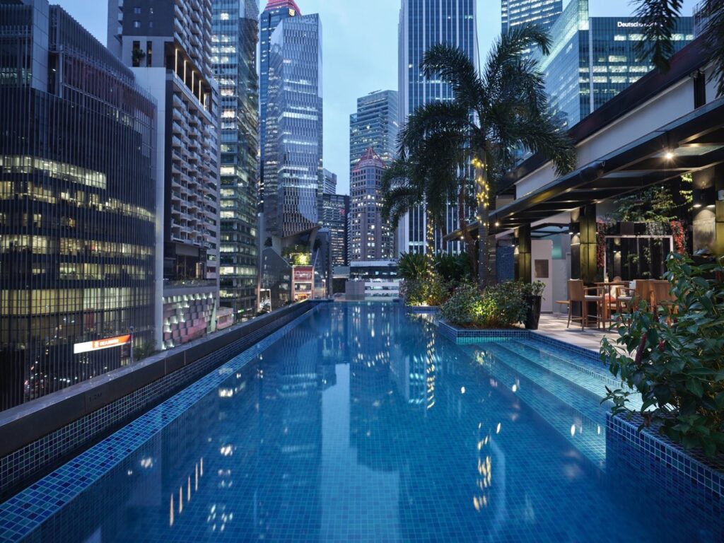 best rooftop bars in singapore - hotel telegraph's 1927 rooftop bar and infinity pool