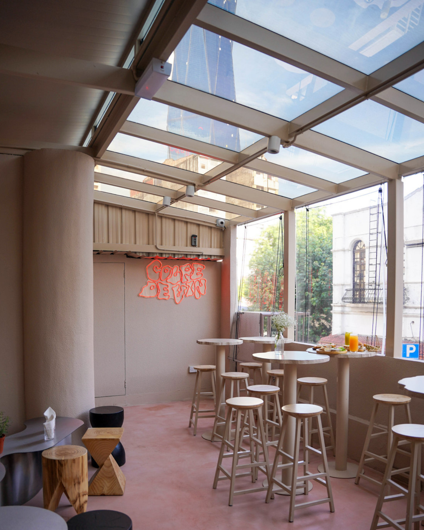 this humble yet trippy bar has a glass ceiling overlooking the Merdeka 118 Tower
