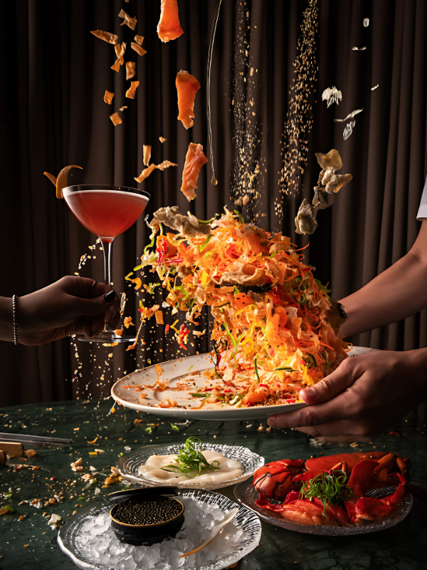 The ultimate Chinese New Year toasting experience by tossing yusheng with a glass of drink.